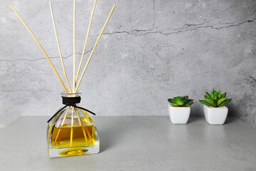 The luxury scented aroma room fresherner reed diffser glass bottle with black fiber sticks in the...