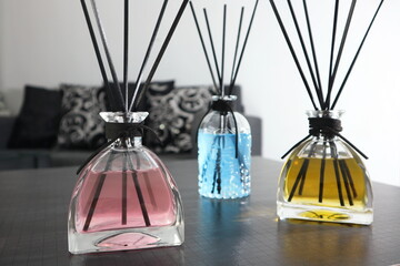 The luxury scented aroma room fresherner reed diffser glass bottle with black fiber sticks in the...