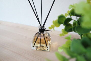 The luxury scented aroma room fresherner reed diffser glass bottle with black fiber sticks in the...