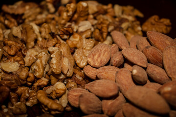 Closeup shot of  a salted almonds and walnuts