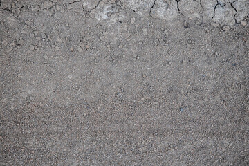 texture and background of cracked earth, soaked by the rain