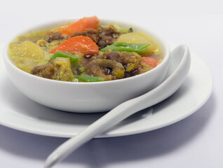 Home-made Beef and Vegetable Soup. on white background. Asian Kitchen.