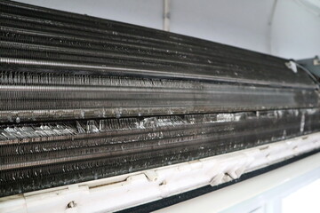 the process of clean and wash the air condition with the high pressure electric pump in the bedroom during hot summer