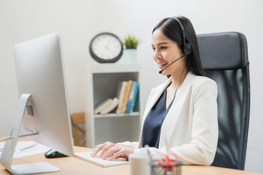 Young Business Asian Woman Working Call Centre Customer Service Agents. Business Female Support Operator With Computer And Headset In Office.