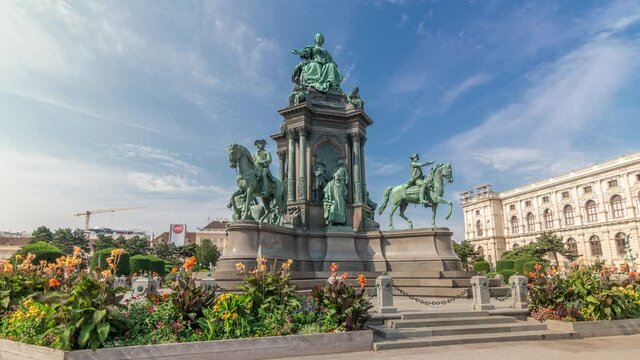 Empress Maria Theresia Monument timelapse hyperlapse and Museums Quartier on a background in Vienna, Austria. Famous Natural History Museum with park and sculptures near in Vienna, Austria