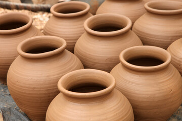 Fototapeta na wymiar clay pots on a wooden table