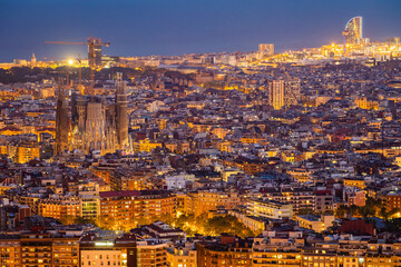 Aerial view of Barcelona cityscape at dusk in Catalonia, Spain.