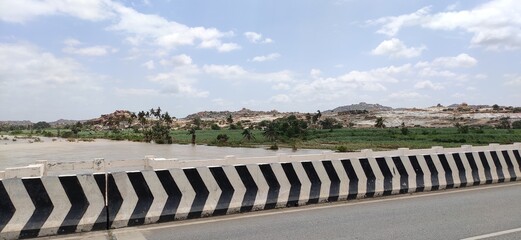 river that is across the historical town hampi , lakes