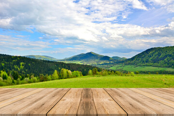 Wooden table top with the blurred mountain landscape, Low Beskids, Poland