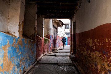 Street scene with wanderer in Fes, Morocco
