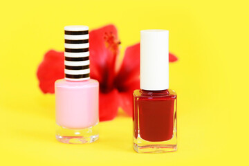 red and pink nail Polish in glass bottles