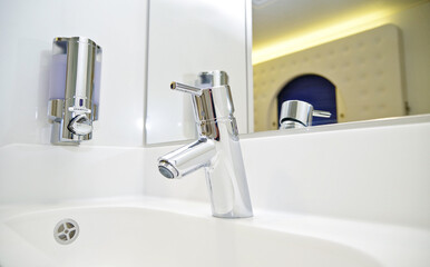 Modern and clean interior design inside bathroom of single occupancy cabin or stateroom called...