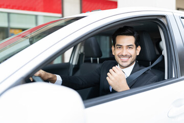 Confident Businessman Driving Car