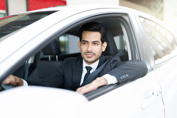 Thoughtful Businessman Driving Car