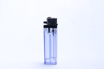 gas lighter with transparent blue container. a tool to burn against a white background