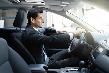 Young Businessman Driving Car