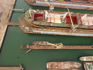 repair vessels hull  (ship, tanker) in shipyard