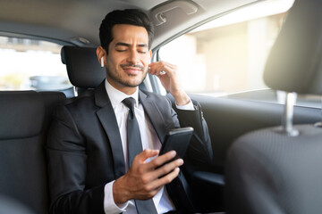 Fototapeta na wymiar Businessman Listening Music In Car