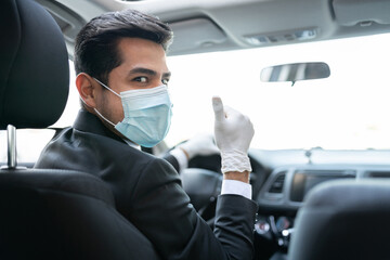 Male Driver In Car During Coronavirus Outbreak