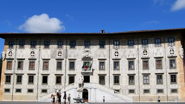 External and dynamic view of the building of Napoleon historic University with decorations in Knights Square in Pisa - Piazza dei Cavalieri - Real Time