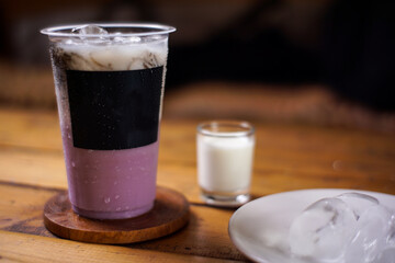 variant of cold drinks with fruit flavor. fresh cafe menu with dark background. colorful ice mockups with plastic cups. grape, chocolate, strawberry, mango, grass jelly,  blueberries, guava