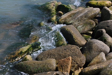 Sea pebble. Sea stones background. Ocean beach rocks.