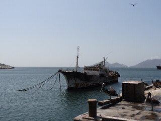 Corroded shipwreck of a motorship in the harbour of Samanco (Central coast of Peru)