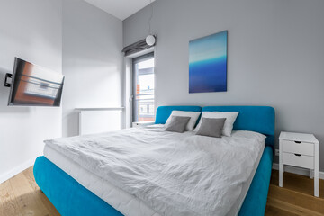 Modern bedroom with blue bed