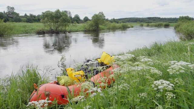 River rafting in summer. Packrafting in wilderness. Raft on the banck of river. Derzha River, Tver Region, Russia.