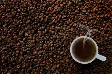 Freshness hot  coffee with coffee beans background
