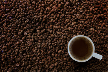 Freshness hot  coffee with coffee beans background
