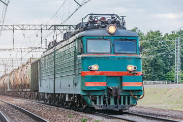 Fototapeta na wymiar Freight train with oil approaches to the station.