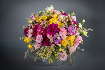 Big and small bouquet on grey background