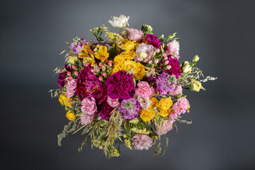 Big and small bouquet on grey background