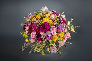 Big and small bouquet on grey background