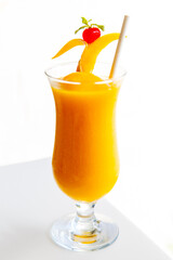 Fresh tropical fruit smoothie mango juice on restaurant. Mango shake close up. Tropical fruit concept