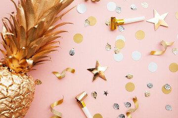 Flat lay tropical pineapple and confetti party celebration background