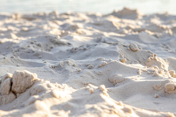 Background and texture of the yellow sea sand close up.