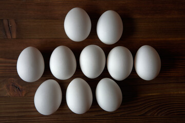 Eggs on a wooden table. View from above.