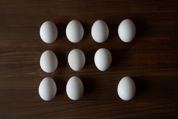 Eggs on a wooden table. View from above.