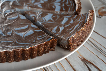 Chocolate cake with nuts, laid on a plate. Beautifully cut piece-2.