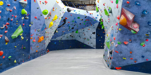 A general view of indoor climbing wall for climbing. Bouldering wall.