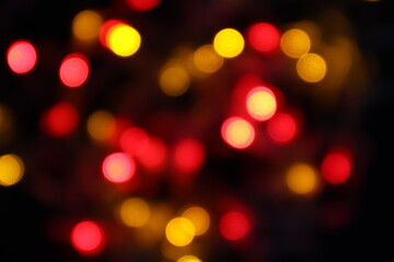 black abstract background of defocused bokeh colorful blurred beautiful shiny illuminate
