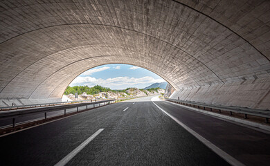 Freeway through the tunnel. Concrete car tunnel.