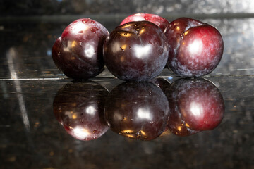 Prunes on a black background