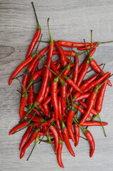 chili peppers top on wooden background