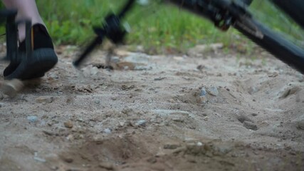 Fall off the bike. Sandy ground. Uncertain ride. Fall to the ground.