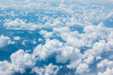 Blue sky with cloud from airplane window