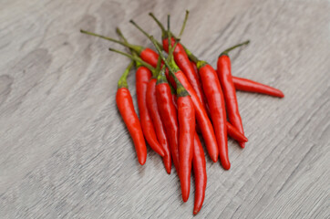 Red chili pepper on wooden table