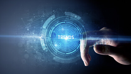 Hand touching TRENDS button, modern business technology concept